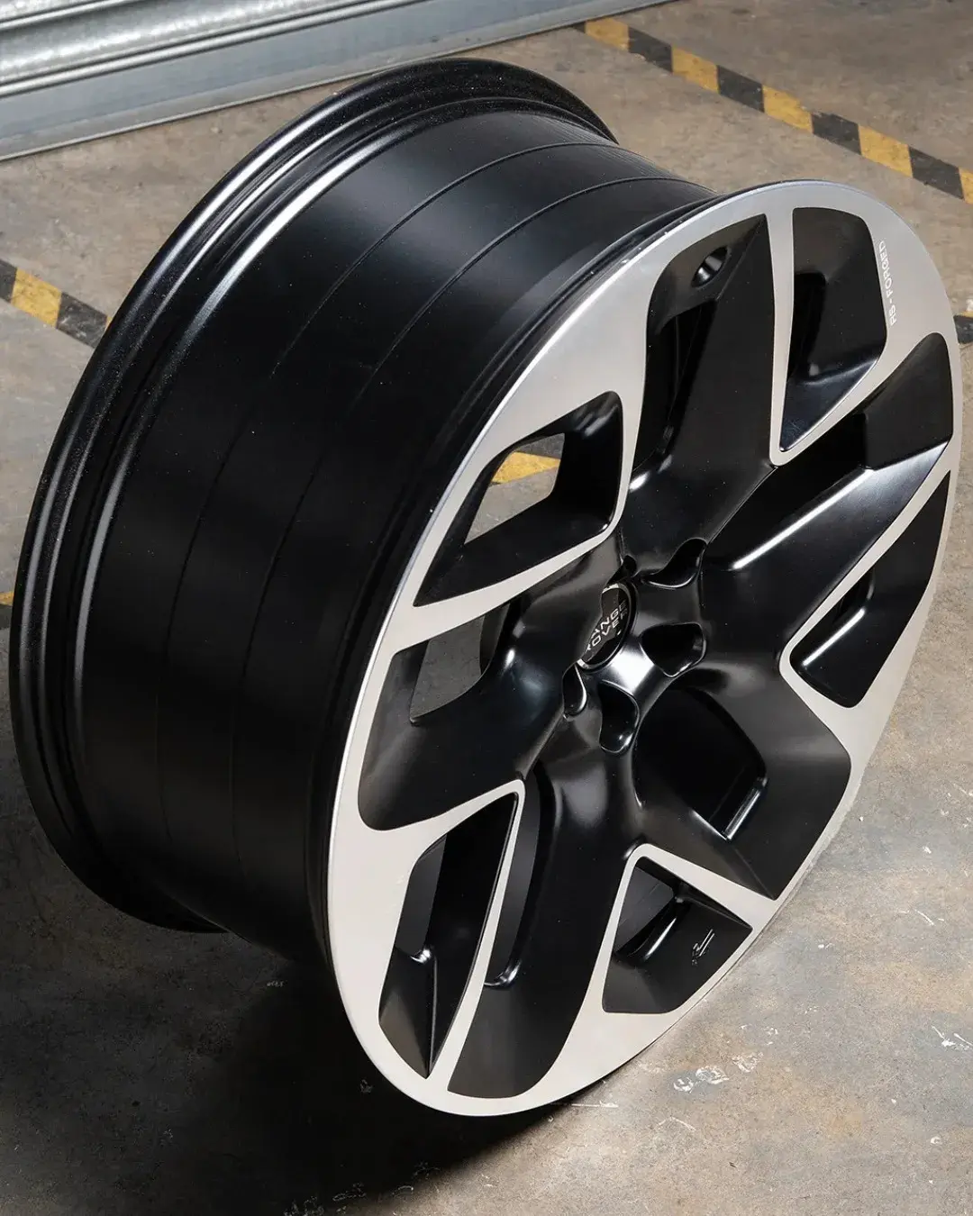 Close view of an alloy wheel rim edge rebuilt and refinished at the Larkhall workshop