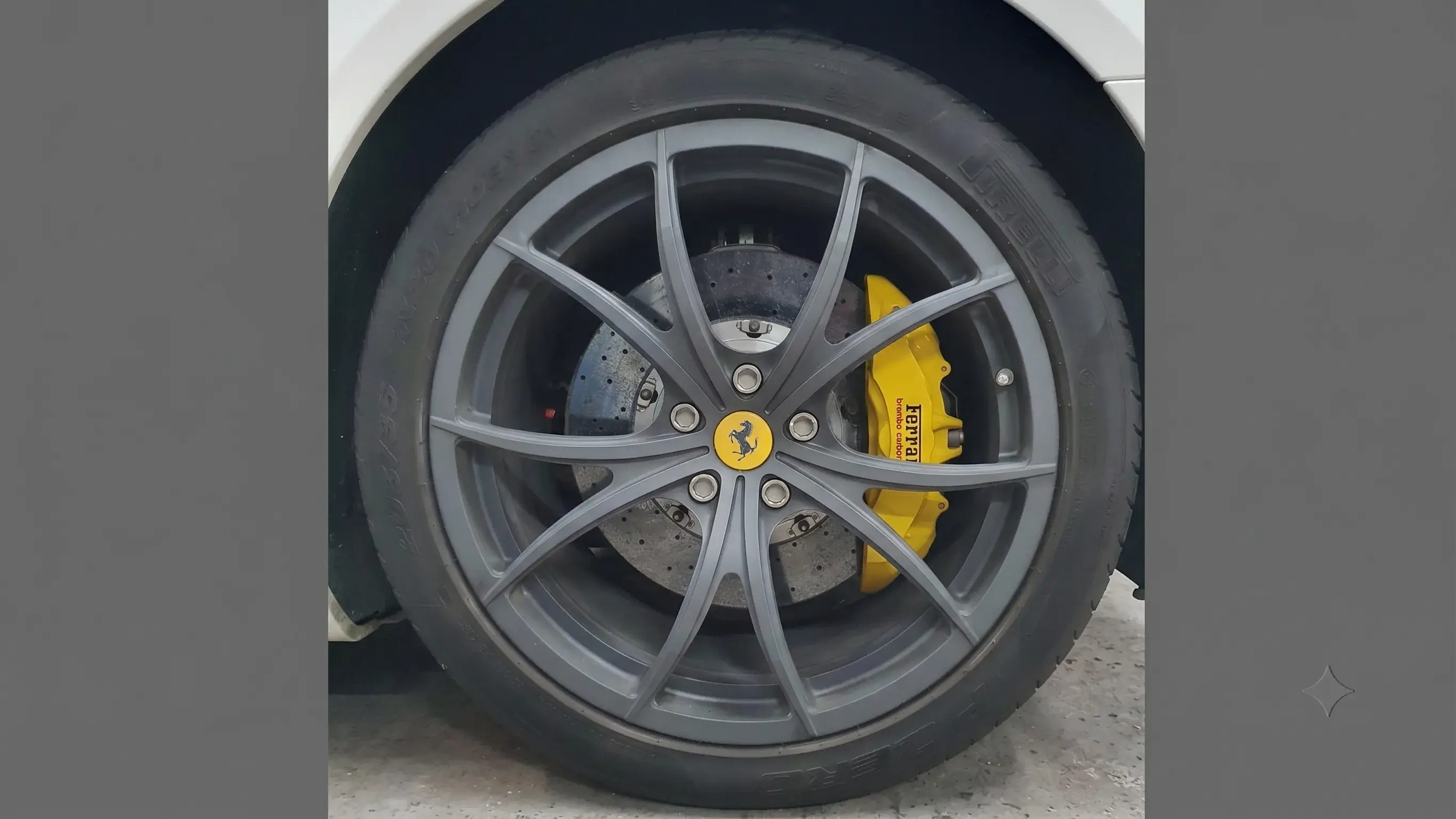 Kerbed and corroded alloy wheel before refurbishment